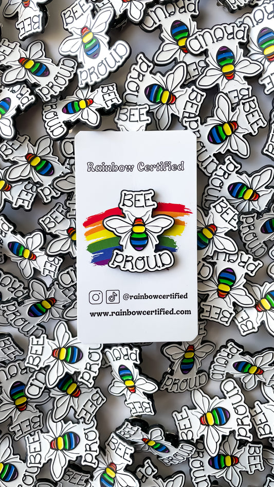 Bee Proud Enamel Pin; Bee with rainbow body that says "Bee Proud"
