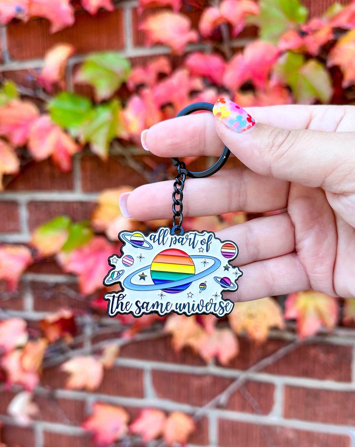 All Part of the Same Universe Enamel Keychain